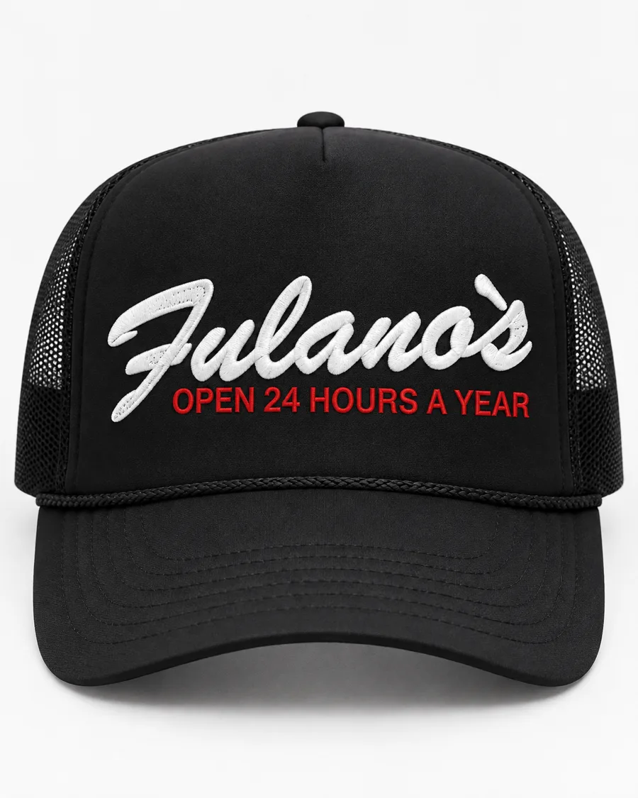 Black foam trucker hat with white script “Fulano’s” and red “Open 24 Hours a Year”